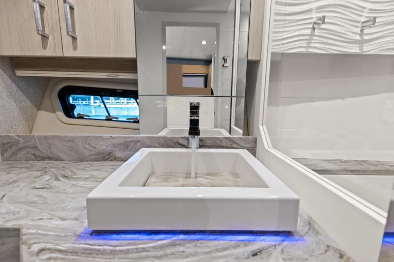 Slide: The Image of Modern bathroom sink in 2025 Formula 500 Super Sport Crossover yacht, featuring sleek design and ambient lighting. - 49