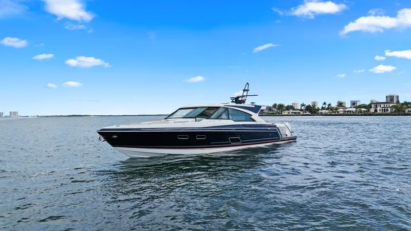 Slide: The Image of 2025 Formula 500 Super Sport Crossover yacht cruising on open water under a clear blue sky. - 6