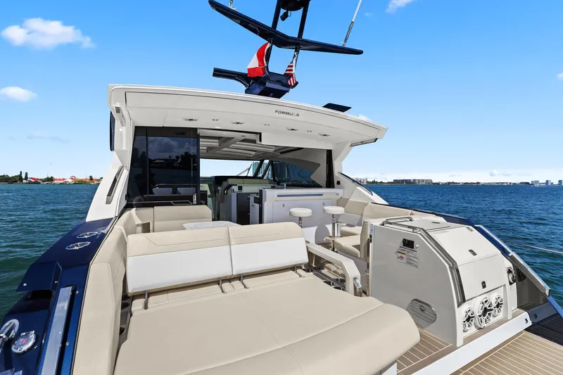 Slide: The Image of 2025 Formula 500 Super Sport Crossover yacht with spacious deck and luxurious seating. - 9