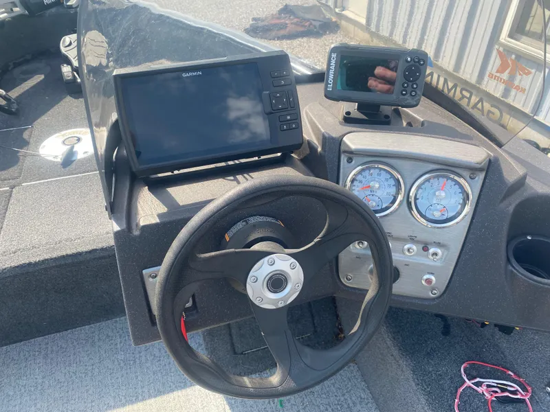 Slide: The Image of 2021 Tracker Pro Guide V-16 WT dashboard with steering wheel, gauges, and electronic displays. - 11