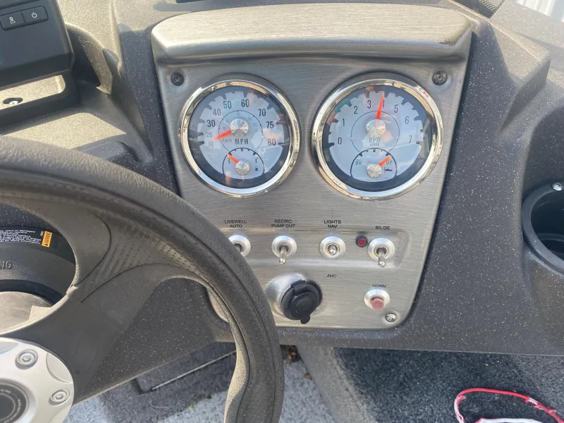 Slide: The Image of Dashboard of 2021 Tracker Pro Guide V-16 WT boat with gauges and controls. - 12