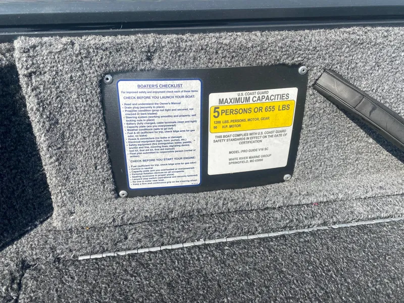 Slide: The Image of 2021 Tracker Pro Guide V-16 WT capacity label, maximum 5 persons or 655 lbs. - 13