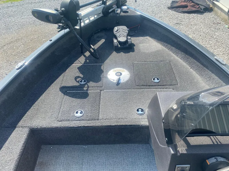 Slide: The Image of 2021 Tracker Pro Guide V-16 WT boat interior with fishing deck and equipment. - 14