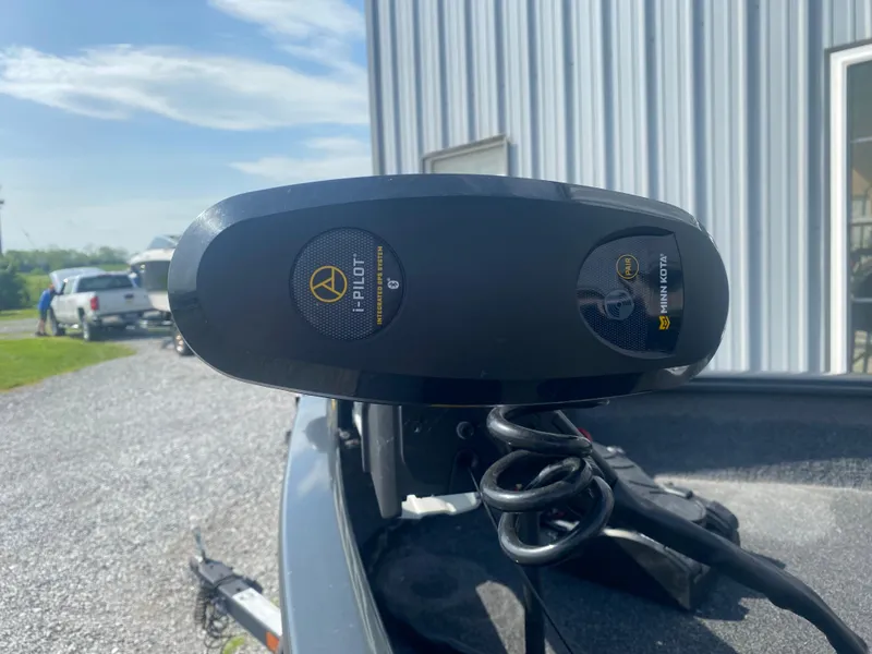 Slide: The Image of 2021 Tracker Pro Guide V-16 WT boat with i-Pilot trolling motor in a sunny outdoor setting. - 5