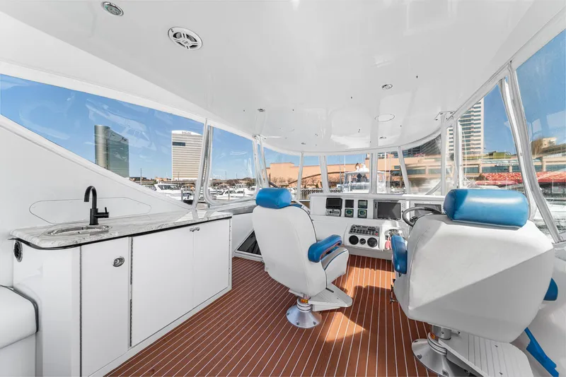 Slide: The Image of Luxurious 2007 Marquis 55 LS yacht interior with modern helm and seating. - 12