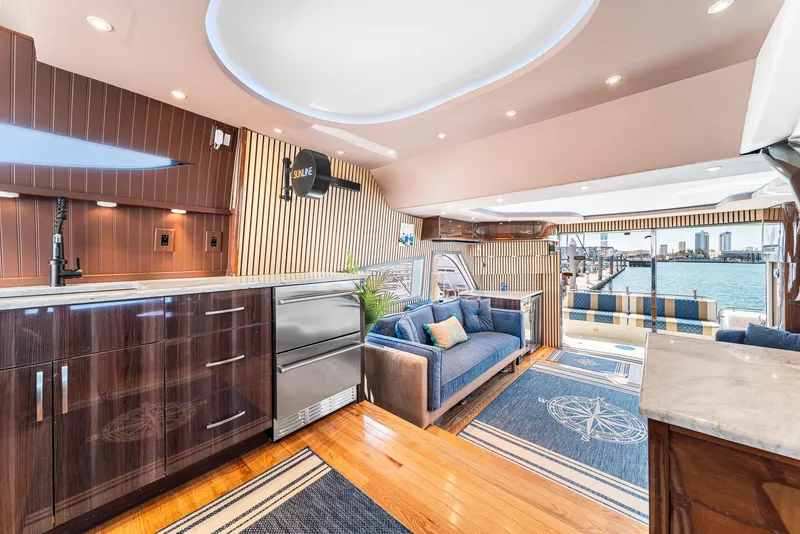 Slide: The Image of Luxurious interior of a 2007 Marquis 55 LS yacht with modern furnishings and waterfront view. - 23