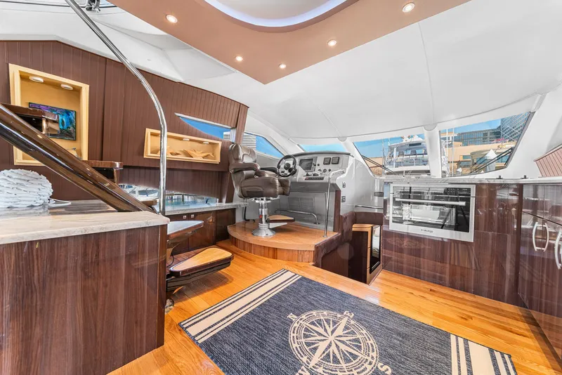 Slide: The Image of Luxurious interior of a 2007 Marquis 55 LS yacht with modern helm and kitchen. - 24