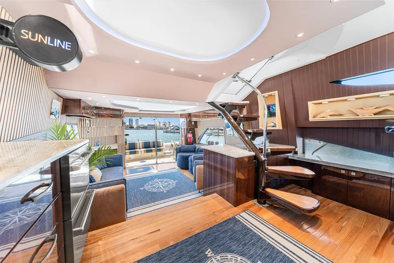 Slide: The Image of Luxurious interior of a 2007 Marquis 55 LS yacht with modern design and waterfront view. - 28