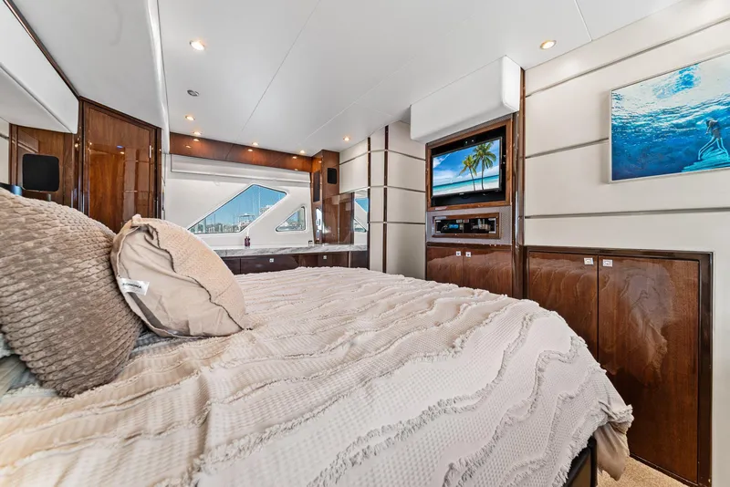 Slide: The Image of Luxurious 2007 Marquis 55 LS yacht bedroom with elegant decor and modern amenities. - 32