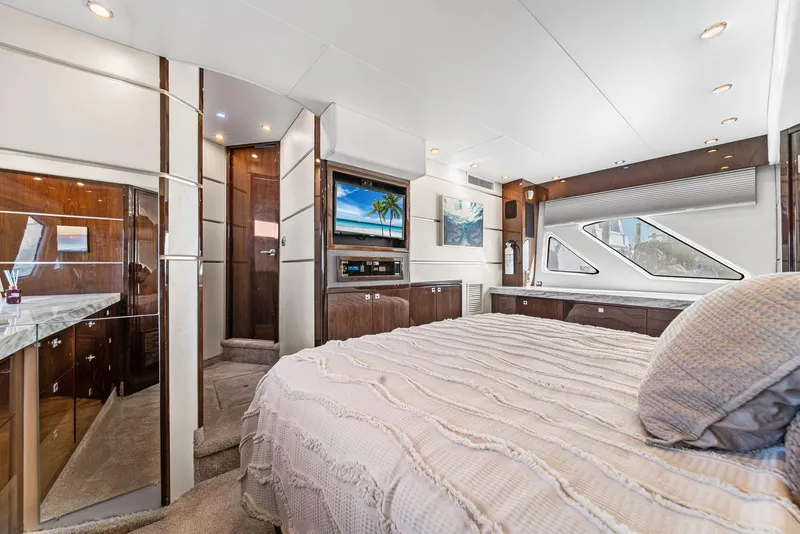 Slide: The Image of Luxurious interior of a 2007 Marquis 55 LS yacht with elegant bedroom and modern amenities. - 33