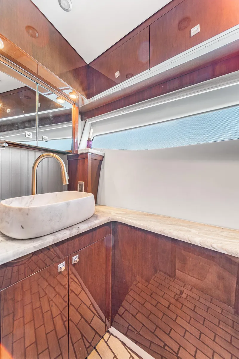 Slide: The Image of Luxurious bathroom in 2007 Marquis 55 LS yacht with modern sink and wooden cabinetry. - 36