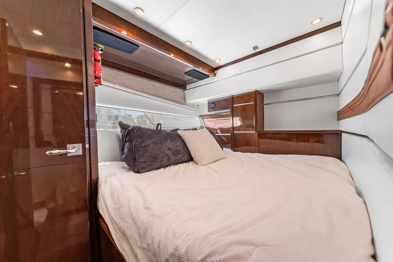 Slide: The Image of Luxurious cabin interior of a 2007 Marquis 55 LS yacht with plush bedding. - 37