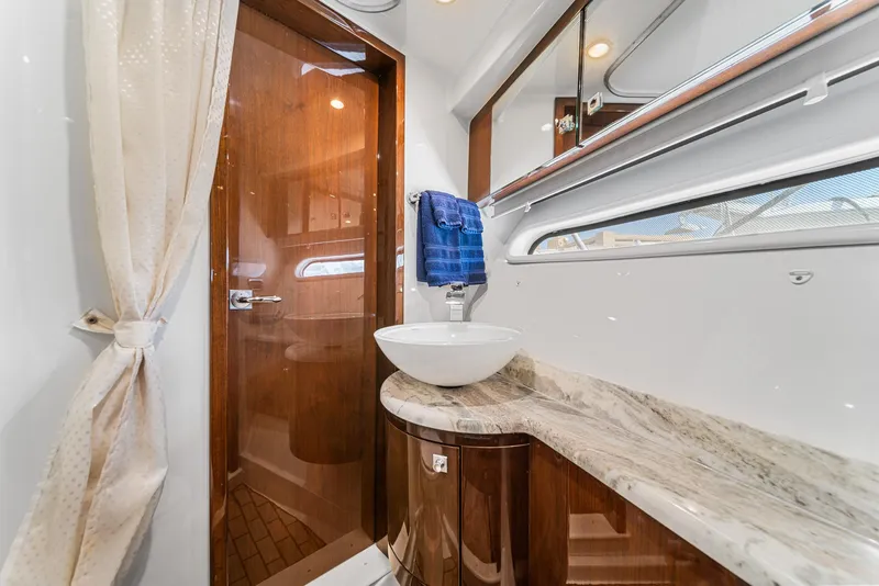 Slide: The Image of Luxurious bathroom in 2007 Marquis 55 LS yacht with elegant wood and marble finishes. - 38