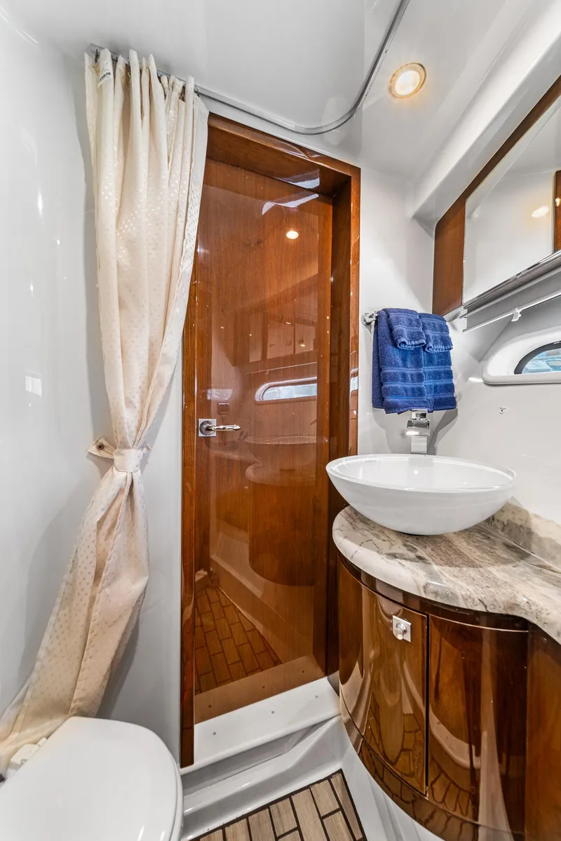 Slide: The Image of Luxurious bathroom in 2007 Marquis 55 LS yacht with elegant wood accents and modern fixtures. - 40