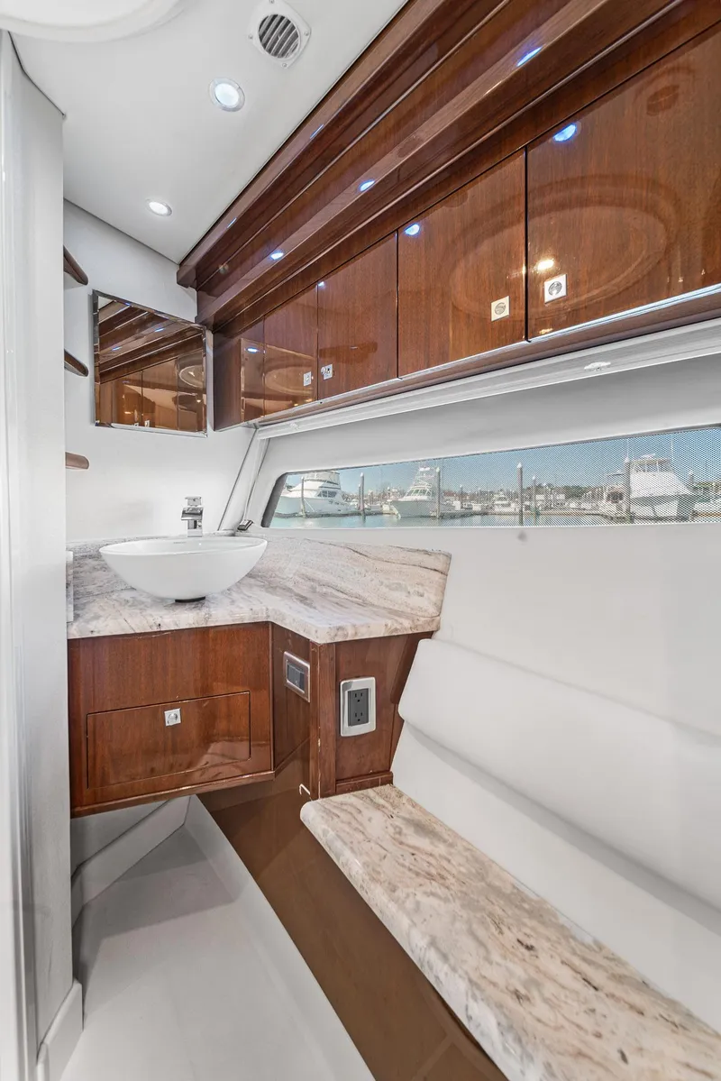 Slide: The Image of Luxurious 2007 Marquis 55 LS yacht interior with elegant wood cabinetry and marble accents. - 41