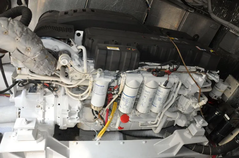 Slide: The Image of Engine of a 2007 Marquis 55 LS yacht, showcasing intricate mechanical components. - 44