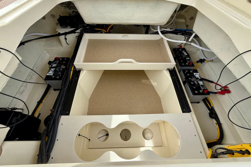 Slide: The Image of Engine compartment of 2026 Chris-Craft Sportster 28, showcasing battery setup and wiring. - 14