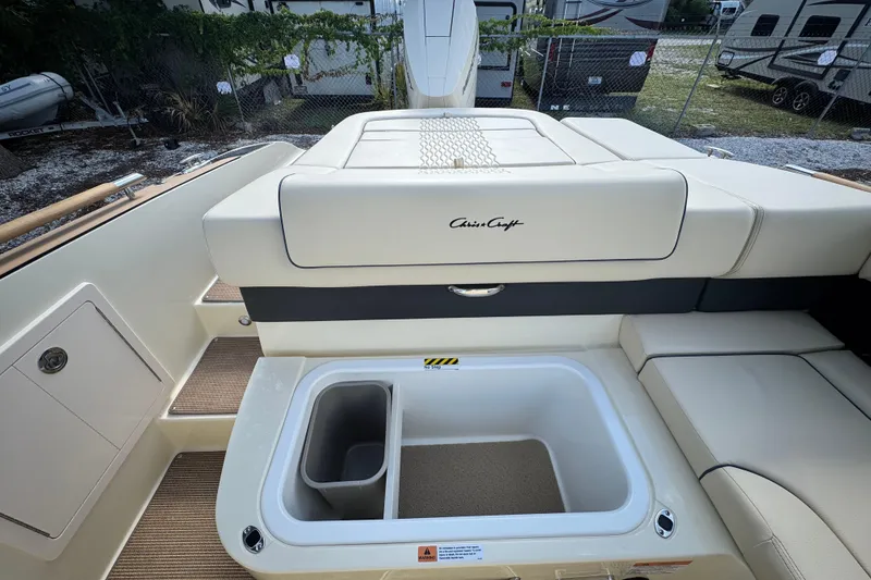 Slide: The Image of 2026 Chris-Craft Sportster 28 boat interior with storage compartment and seating. - 15