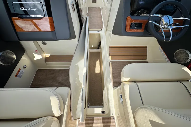 Slide: The Image of 2026 Chris-Craft Sportster 28 interior with luxurious seating and modern dashboard design. - 21