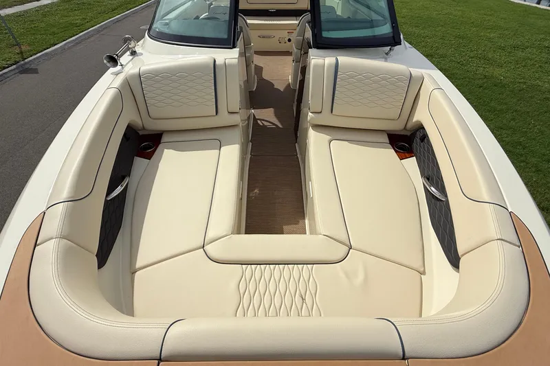 Slide: The Image of 2026 Chris-Craft Sportster 28 boat interior with luxurious beige seating and elegant design. - 32