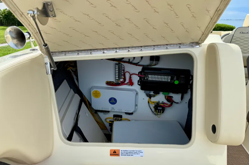 Slide: The Image of 2026 Chris-Craft Sportster 28 electrical compartment with wiring and components visible. - 36