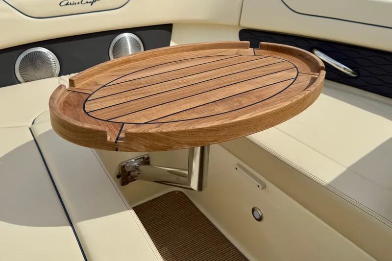 Slide: The Image of 2026 Chris-Craft Sportster 28 interior with elegant wooden table and luxurious seating. - 42