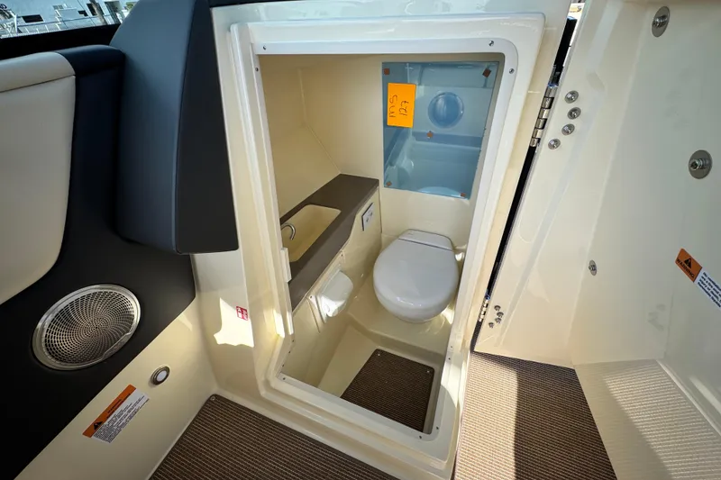 Slide: The Image of 2026 Chris-Craft Sportster 28 boat interior with compact bathroom. - 46