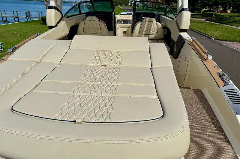 Slide: The Image of Luxurious interior of 2026 Chris-Craft Sportster 28 boat with elegant seating and waterfront view. - 9