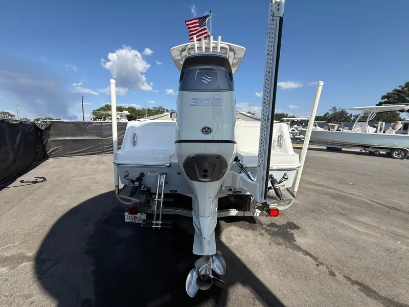 Slide: The Image of 2022 Aquasport 2300 Center Console boat with Suzuki outboard motor, rear view. - 28