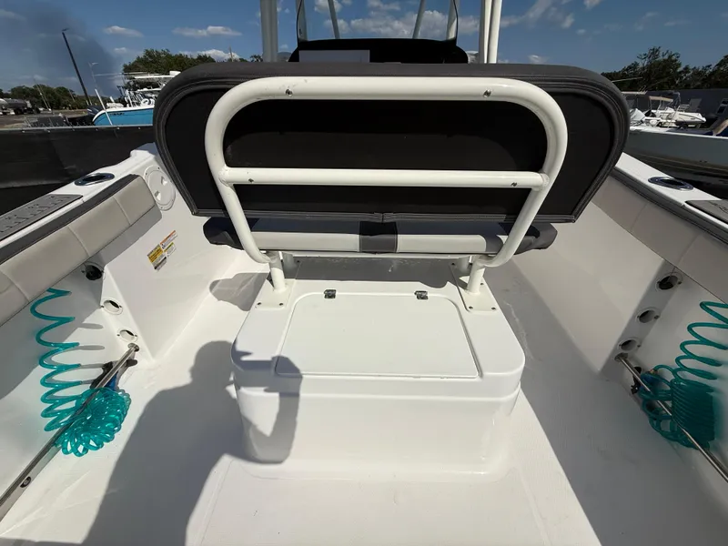 Slide: The Image of 2022 Aquasport 2300 Center Console boat interior with seating and storage. - 37