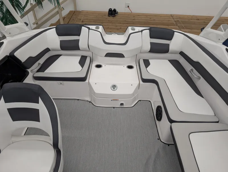 Slide: The Image of 2024 Yamaha Boats AR195 interior with sleek white and gray seating arrangement. - 11
