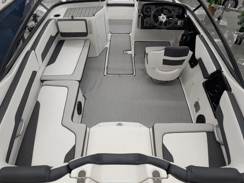 Slide: The Image of 2024 Yamaha Boats AR195 interior with sleek seating and modern steering console. - 4