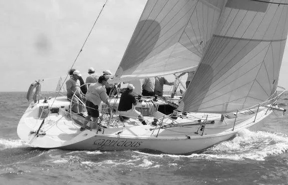 The Image of Sailboat Catalina Capri 37, 1992 model, with crew navigating ocean waters. - 0