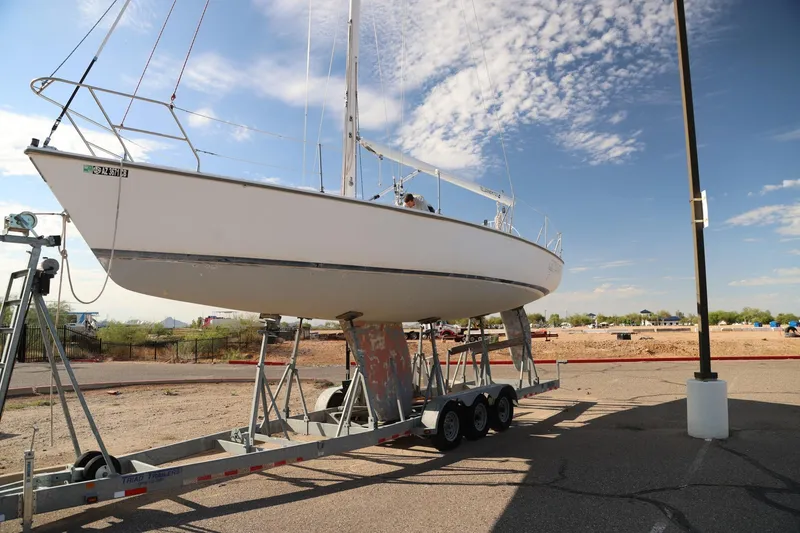 Slide: The Image of 1992 Catalina Capri 37 sailboat on trailer under clear sky. - 1