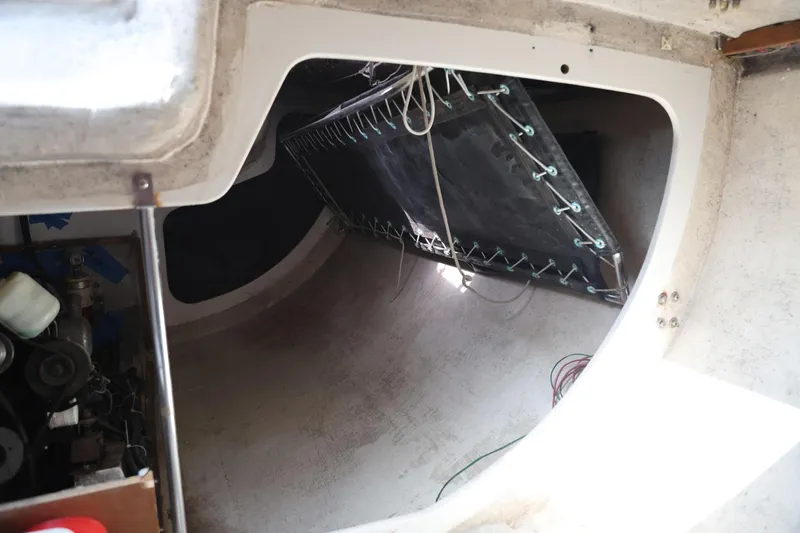Slide: The Image of Interior view of a 1992 Catalina Capri 37 sailboat, showing storage and equipment space. - 10