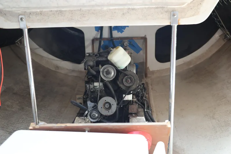 Slide: The Image of Engine compartment of a 1992 Catalina Capri 37 sailboat, showcasing mechanical components. - 12