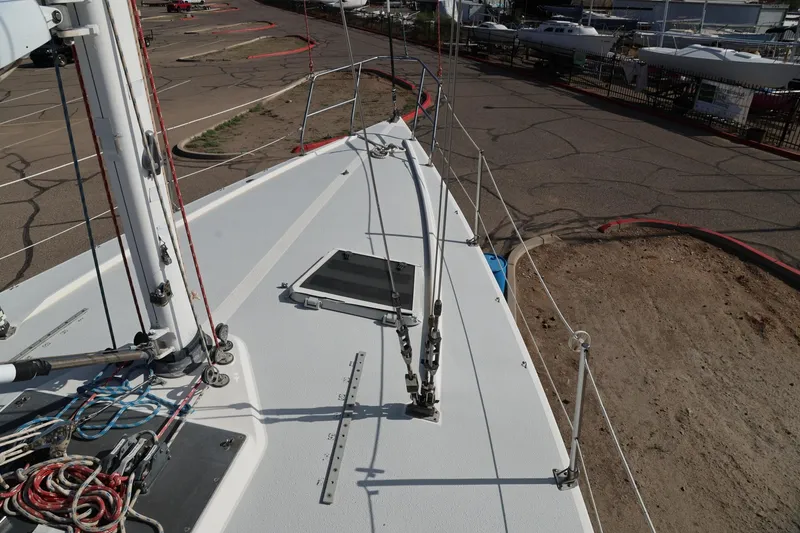 Slide: The Image of Deck view of a 1992 Catalina Capri 37 sailboat in a dry dock area. - 13