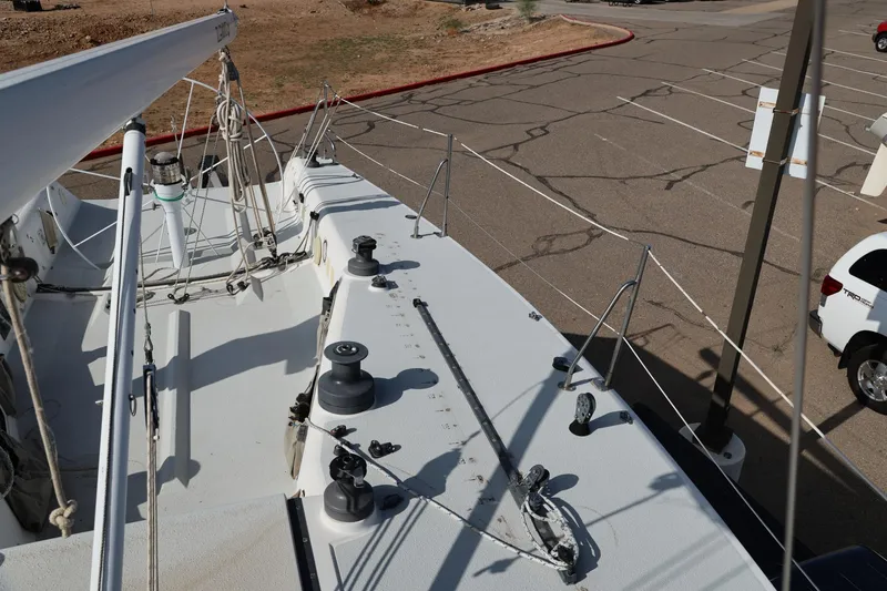 Slide: The Image of Deck view of a 1992 Catalina Capri 37 sailboat in a parking lot. - 16