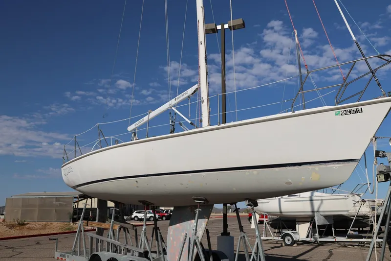 Slide: The Image of Catalina Capri 37 sailboat from 1992 on a trailer under a clear blue sky. - 2