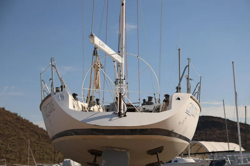 Slide: The Image of Catalina Capri 37 sailboat from 1992 on dry dock, viewed from the stern. - 3