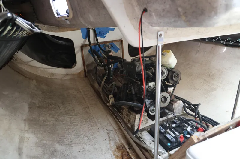 Slide: The Image of Engine compartment of a 1992 Catalina Capri 37 sailboat, showing mechanical components and wiring. - 7