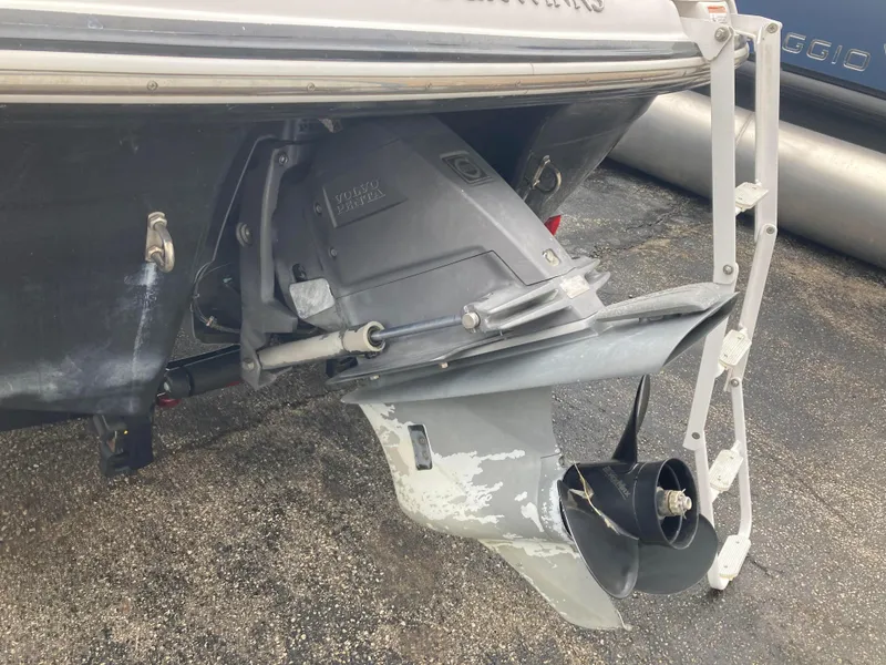 Slide: The Image of 2008 Four Winns H200 boat with Volvo Penta outdrive, showing propeller and ladder. - 15