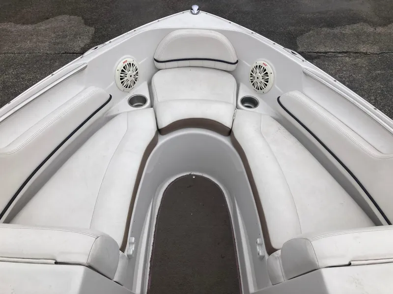 Slide: The Image of 2008 Four Winns H200 boat interior with white seating and built-in speakers. - 5