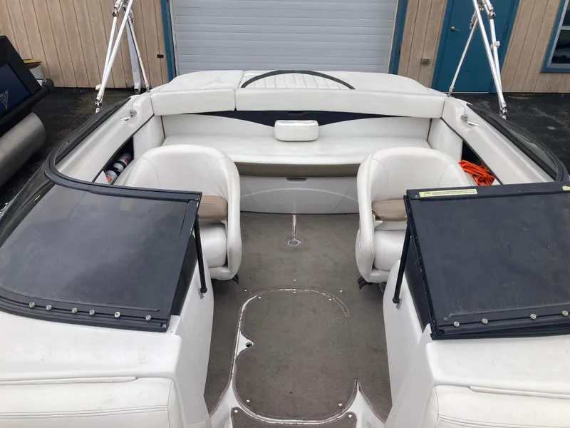 Slide: The Image of 2008 Four Winns H200 boat interior with white seating and open cockpit design. - 6