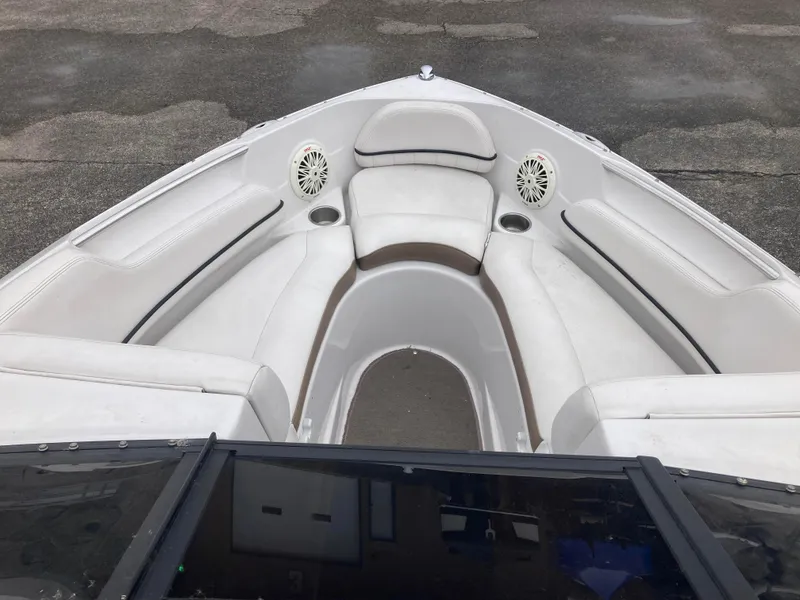 Slide: The Image of 2008 Four Winns H200 boat interior with white seating and cup holders. - 7