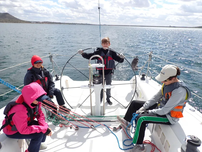 Slide: The Image of People sailing on a 1992 Catalina Capri 37, enjoying a sunny day on the water. - 10