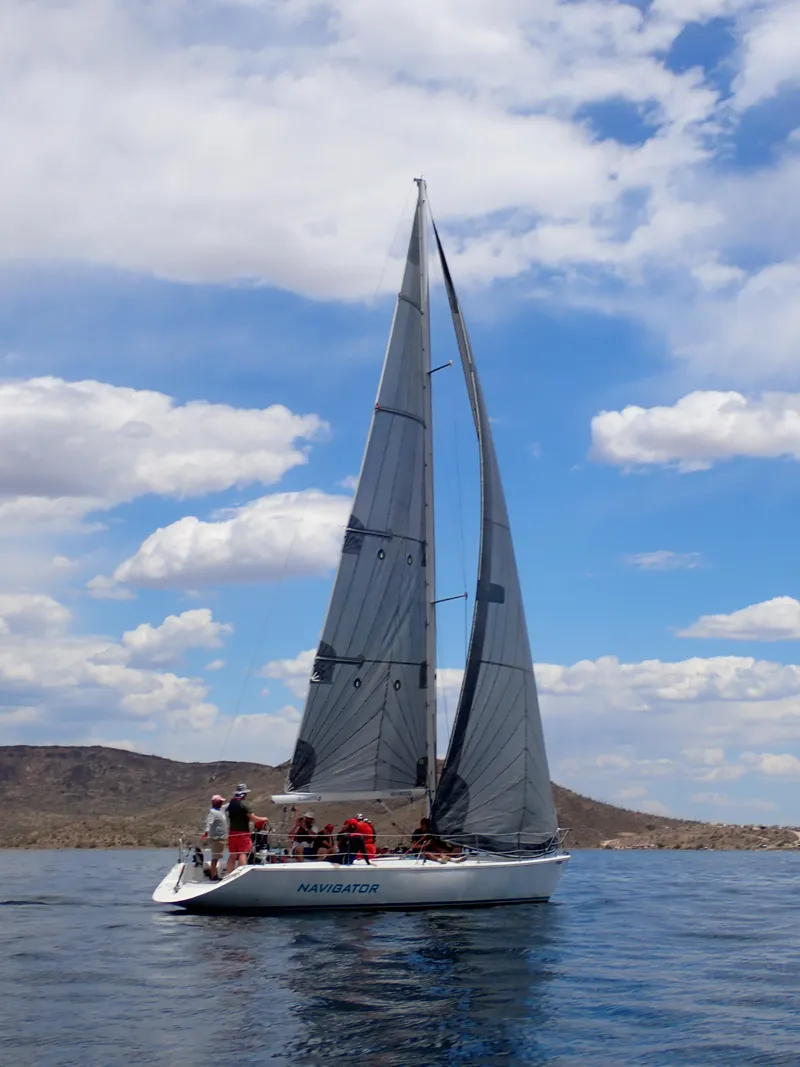 Slide: The Image of Sailboat Catalina Capri 37, 1992 model, sailing on a sunny day with blue skies. - 11
