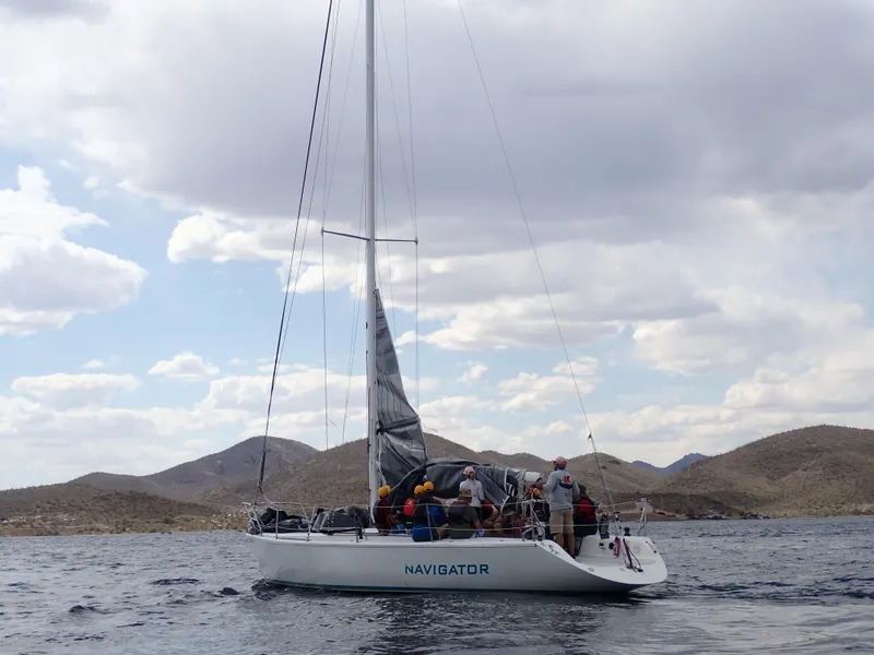 Slide: The Image of Sailboat Catalina Capri 37, 1992 model, on a lake with mountainous backdrop. - 15