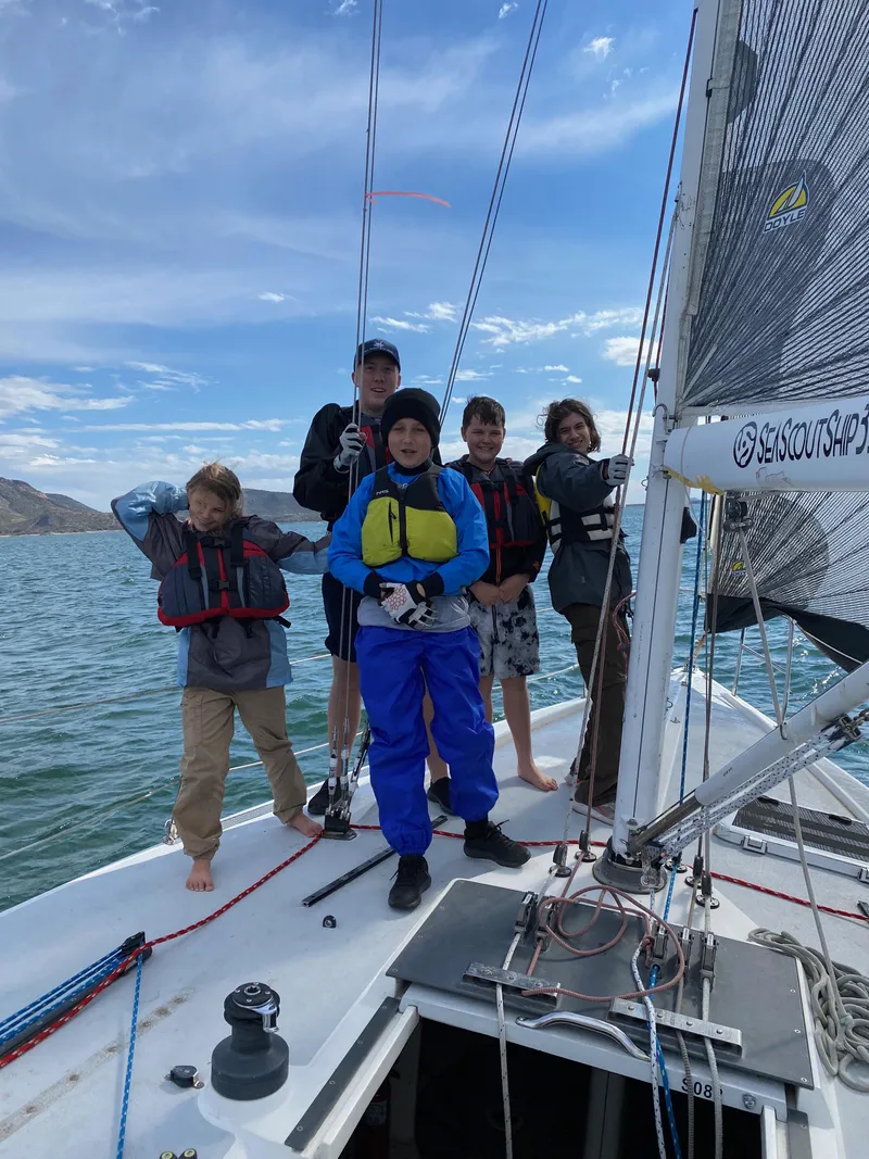 Slide: The Image of Group of kids sailing on a 1992 Catalina Capri 37 boat. - 24