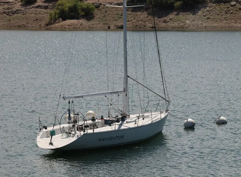 Slide: The Image of Catalina Capri 37 sailboat from 1992 anchored on a calm lake. - 3